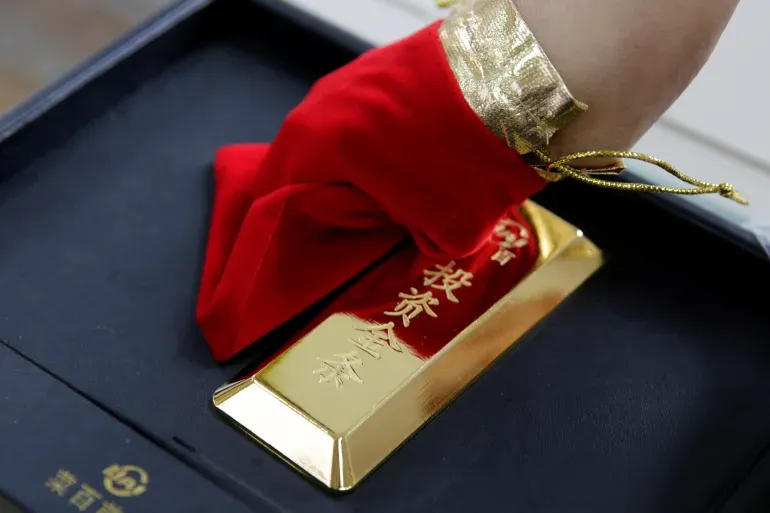 Beijing’s gold purchases reflect a shift away from reliance on US dollar assets, experts say.