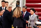 Trump greets Xi Jinping on arrival in rare move as US-China trade truce extended